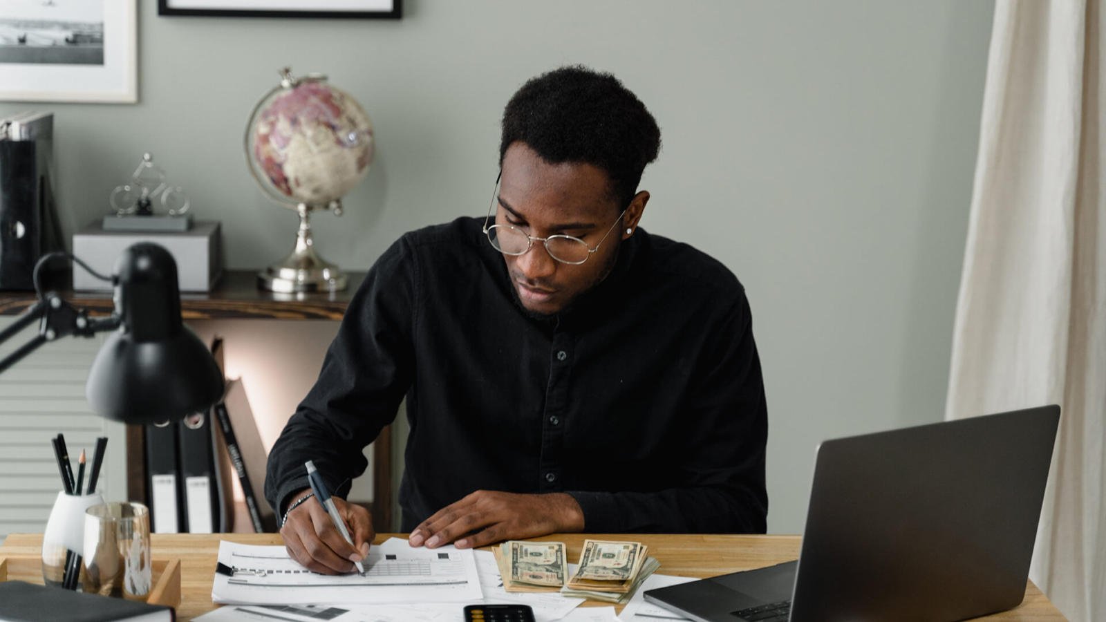 An accountant works on budgets and income records